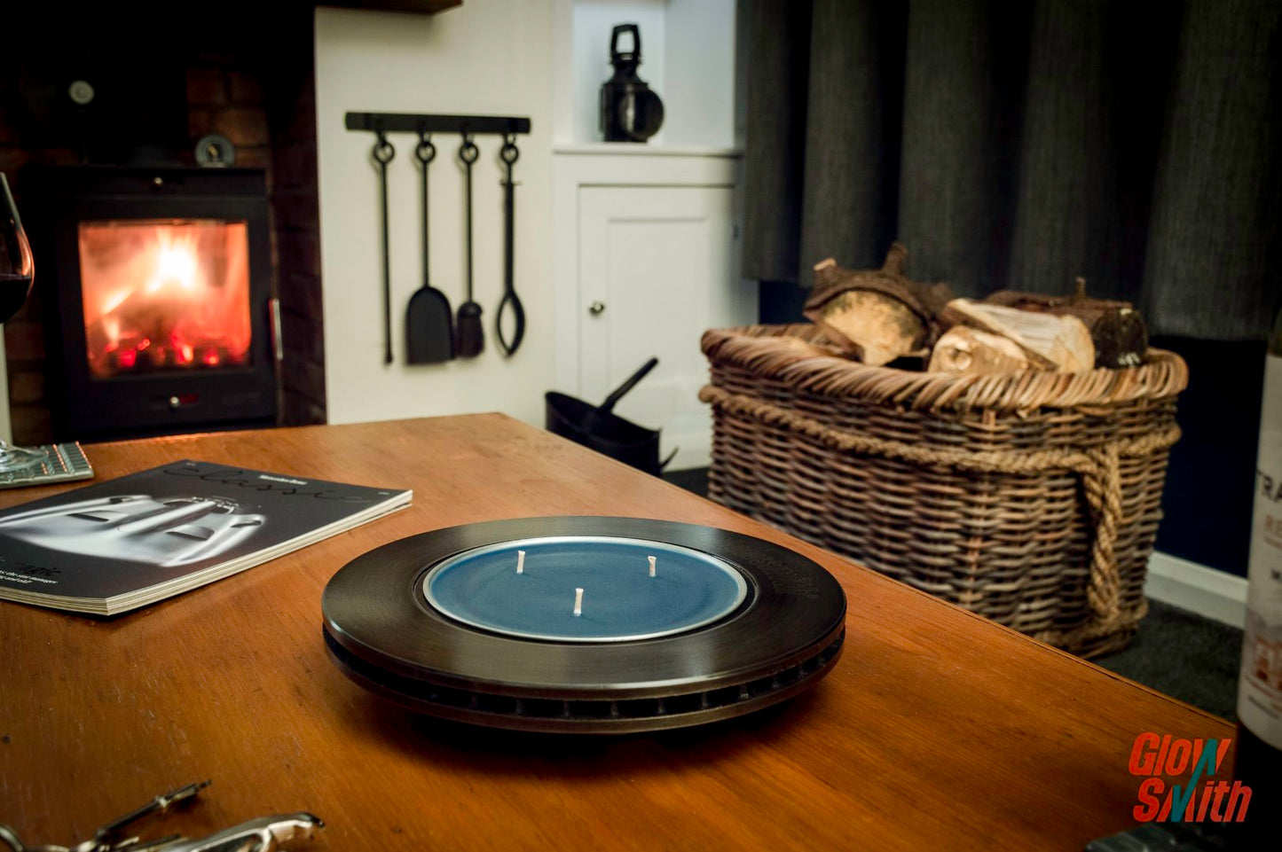 Side angle showing industrial design and premium finish with burning Nordic Pine candle