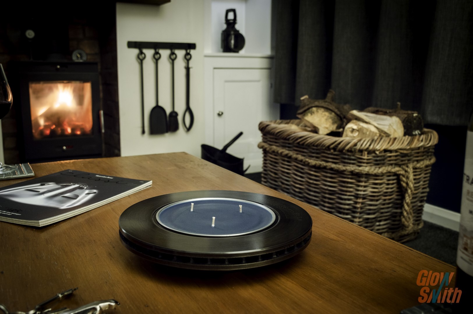 Side angle showing industrial design and premium finish with burning Nordic Pine candle