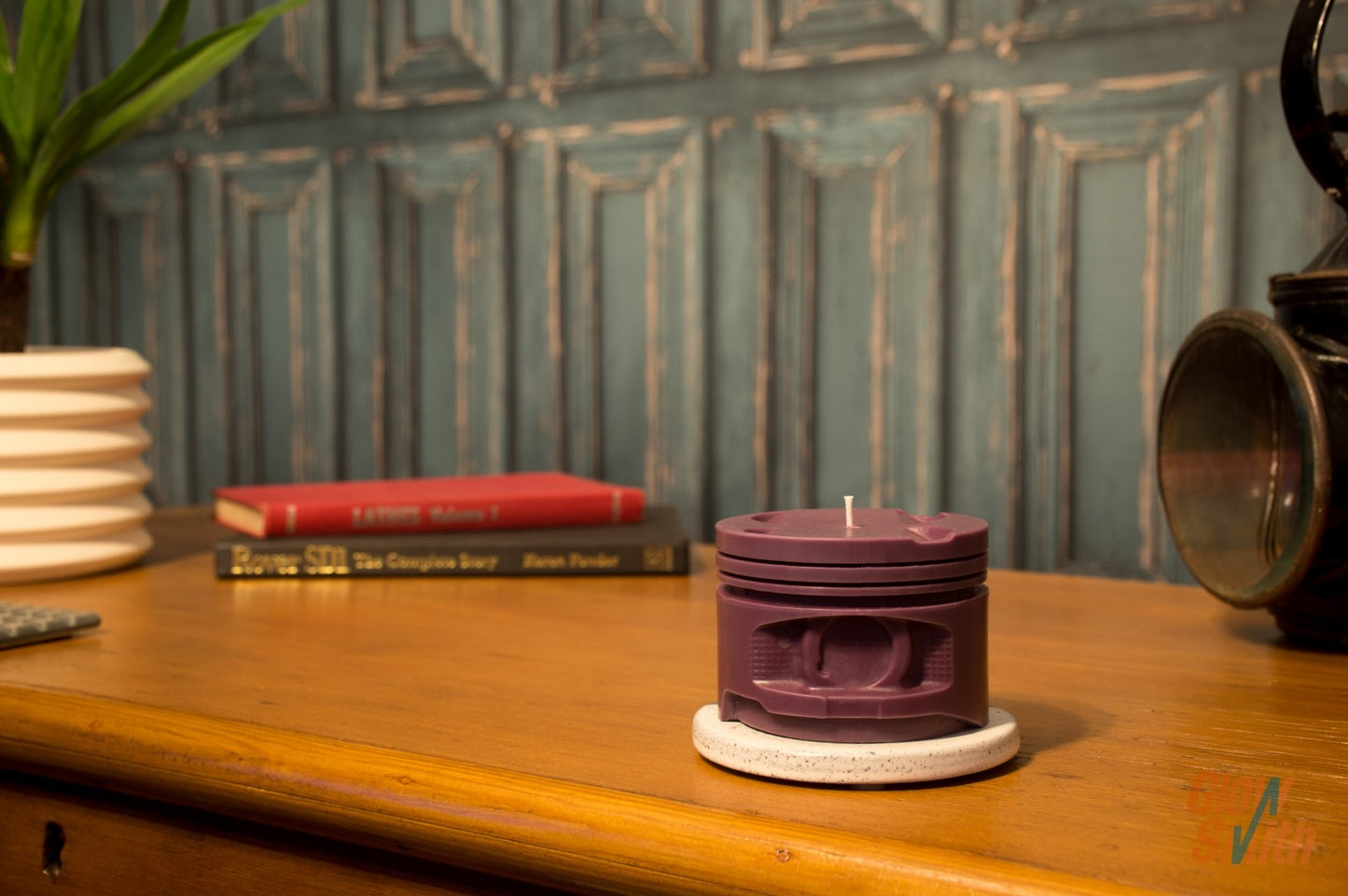 Wild Pomegranate engine piston candle displayed in modern masculine room