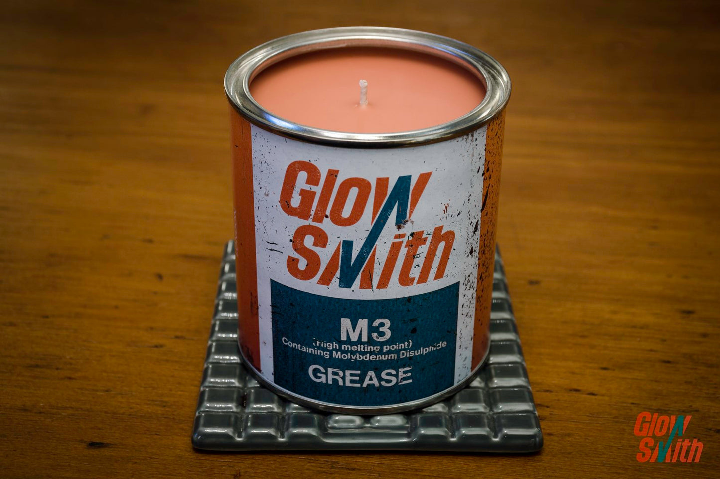 Close-up of the 1970s Vintage Grease Tin Candle, showcasing authentic patina and unique marks, perfect for a man's decor.