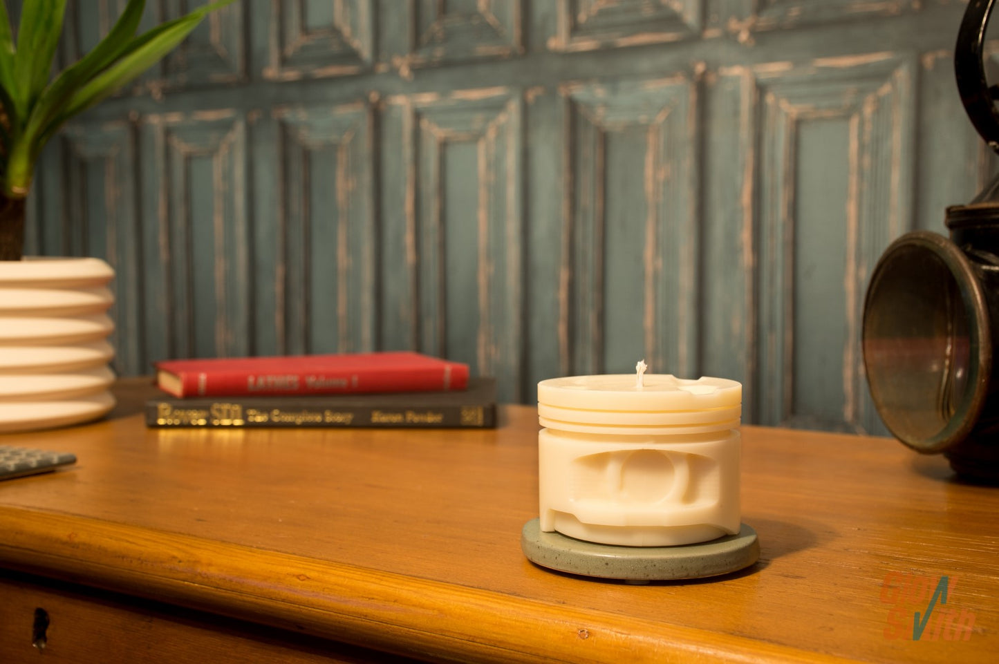 Ivory Smoked Vanilla Engine Piston Candle displayed in a masculine interior, combining automotive style with a calming smoked vanilla scent.
