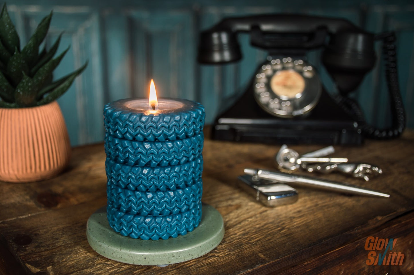 Nordic Pine Tyre Stack candle burning in a lounge – blue sculptural candle, automotive-inspired décor, fresh outdoors masculine fragrance