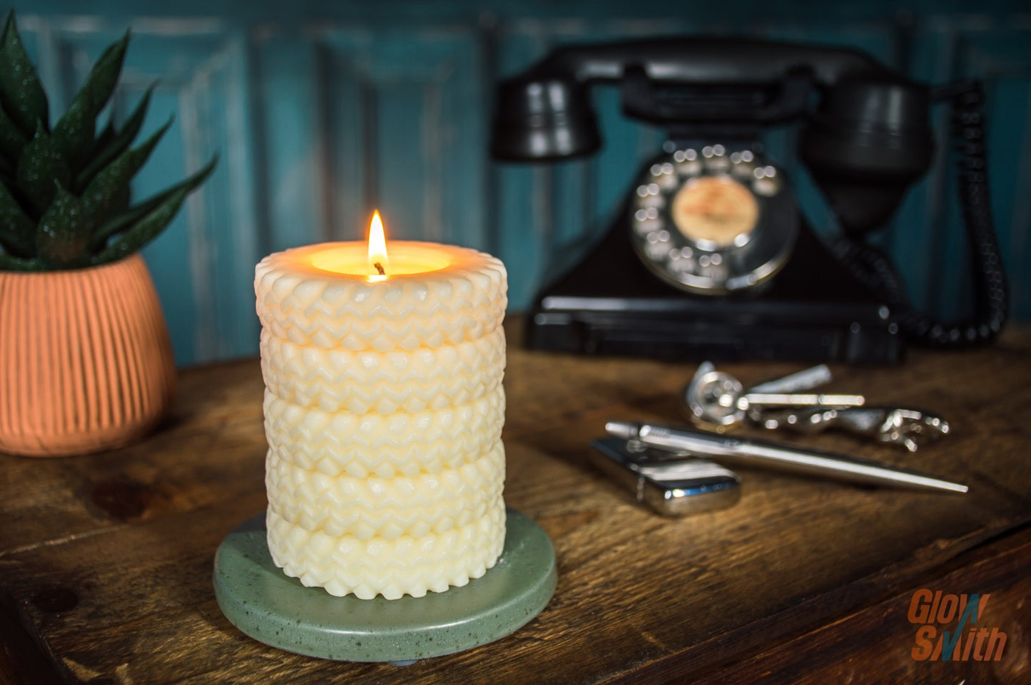 Smoked Vanilla Tyre Stack candle burning in a lounge – ivory sculptural candle, automotive-inspired décor, luxury gift for him