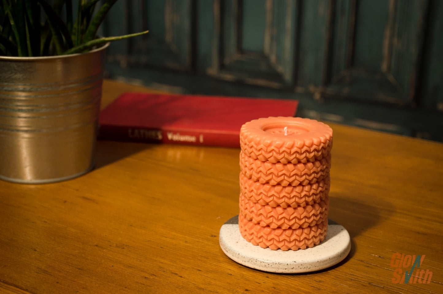 Spiced Orange Tyre Stack candle displayed on a shelf – statement piece, automotive-inspired décor, masculine scented candle