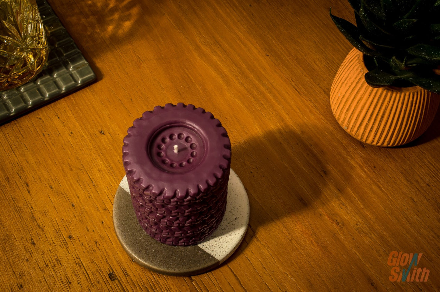 Close-up of Wild Pomegranate Tyre Stack candle – maroon sculptural candle, unique Glowsmith wax blend, calming wild pomegranate scent, ideal gift for him