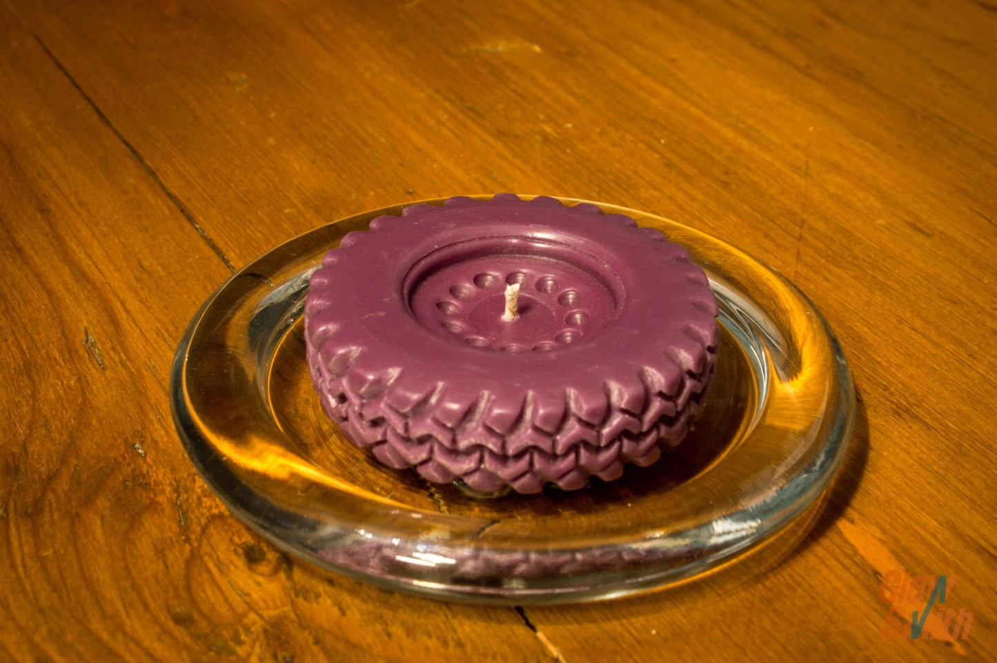 Close-up of a Series Land Rover Tyre Candle, showcasing the intricate wheel tread and unique design