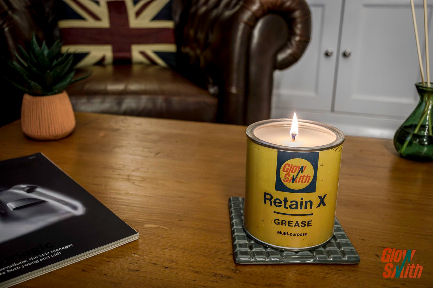 Lit Smoked Vanilla Large Grease Tin Candle, creating a relaxing ambiance in a a gentleman's lounge, an excellent car gift idea.