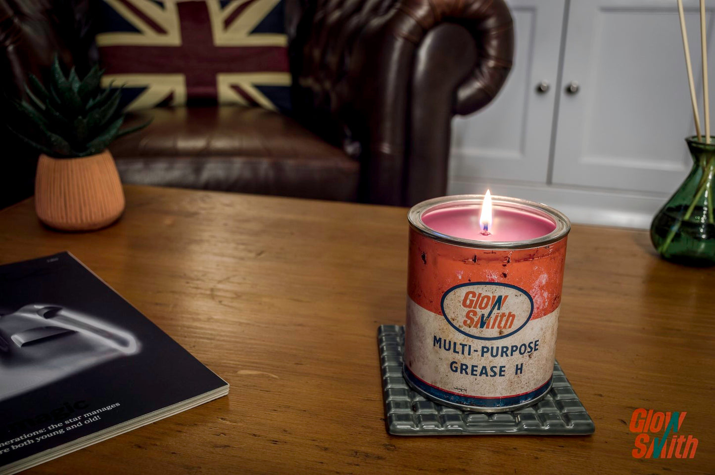 Lit Wild Pomegranate Large Grease Tin Candle, a stunning automotive statement piece for a man cave or home.
