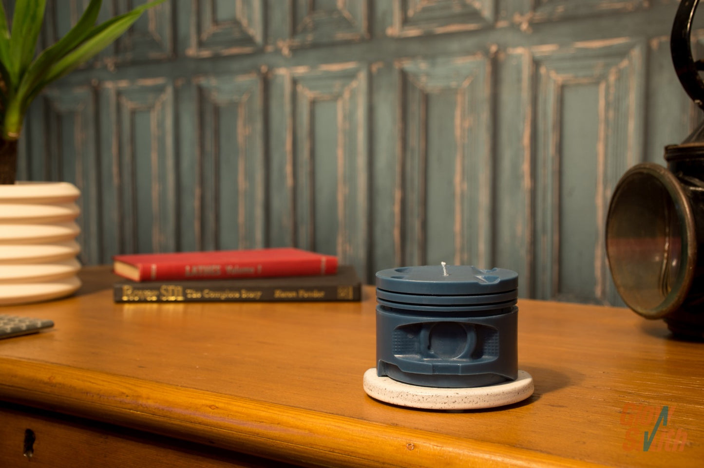 Nordic Pine Engine Piston Candle displayed in a modern masculine interior, combining blue piston design, automotive style, and outdoor-inspired fragrance.