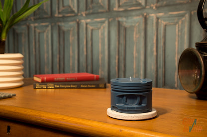 Nordic Pine Engine Piston Candle displayed in a modern masculine interior, combining blue piston design, automotive style, and outdoor-inspired fragrance.