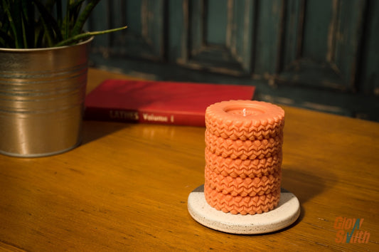 Spiced Orange Tyre Stack candle displayed on a shelf – statement piece, automotive-inspired décor, masculine scented candle